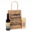 Detalle Bautizo en bolsa Kraft con botella de vino y llavero de madera frases